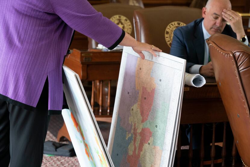 State Rep. JULIE JOHNSON, D-Farmers Branch, looks through the maps as Rep. CHRIS TURNER,...