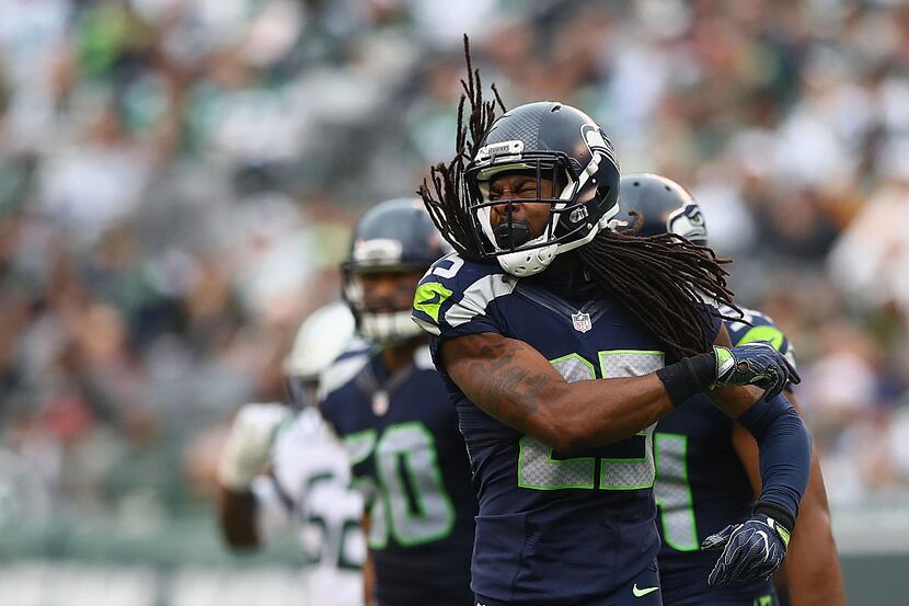 EAST RUTHERFORD, NJ - OCTOBER 02:  Richard Sherman #25 of the Seattle Seahawks celebrates an...