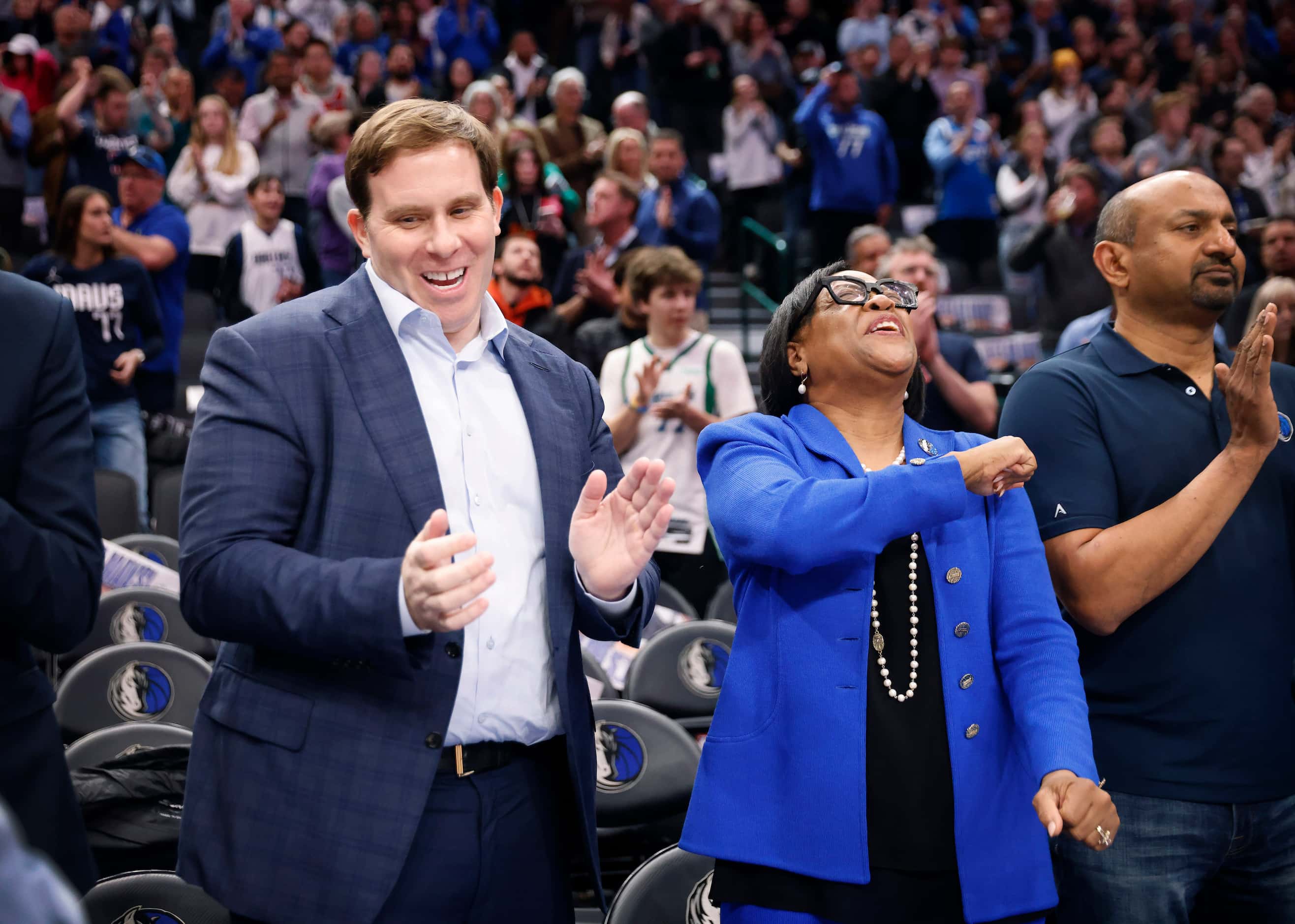 Dallas Mavericks new governor and majority owner Patrick Dumont (left) received a high-five...