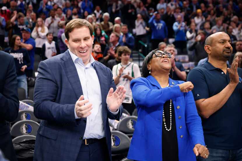 Dallas Mavericks new governor and majority owner Patrick Dumont (left) received a high-five...