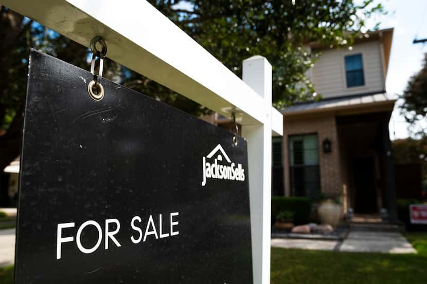 A for sale sign in the Lakewood Heights neighborhood of Dallas on Sept. 28. Dallas-area...