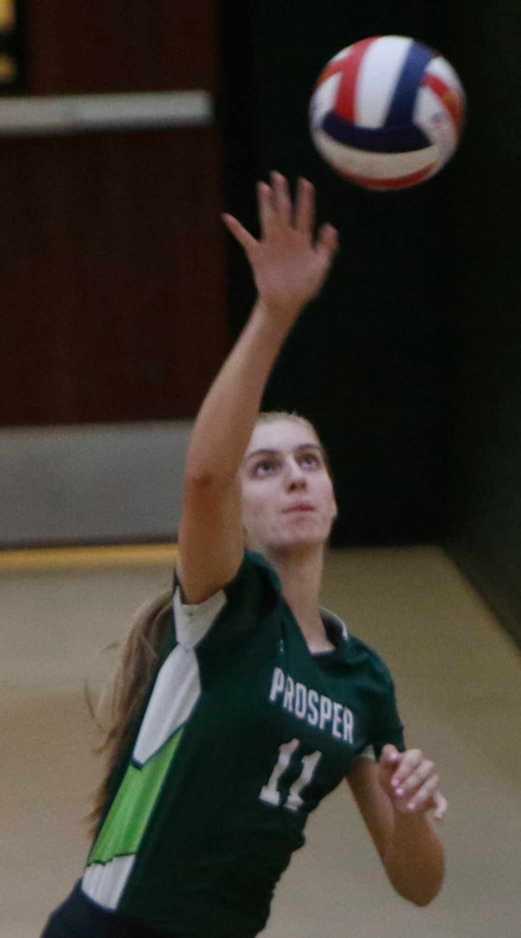 Prosper's Shaylee Shore (11) serves during the first game of their match against Plano West....