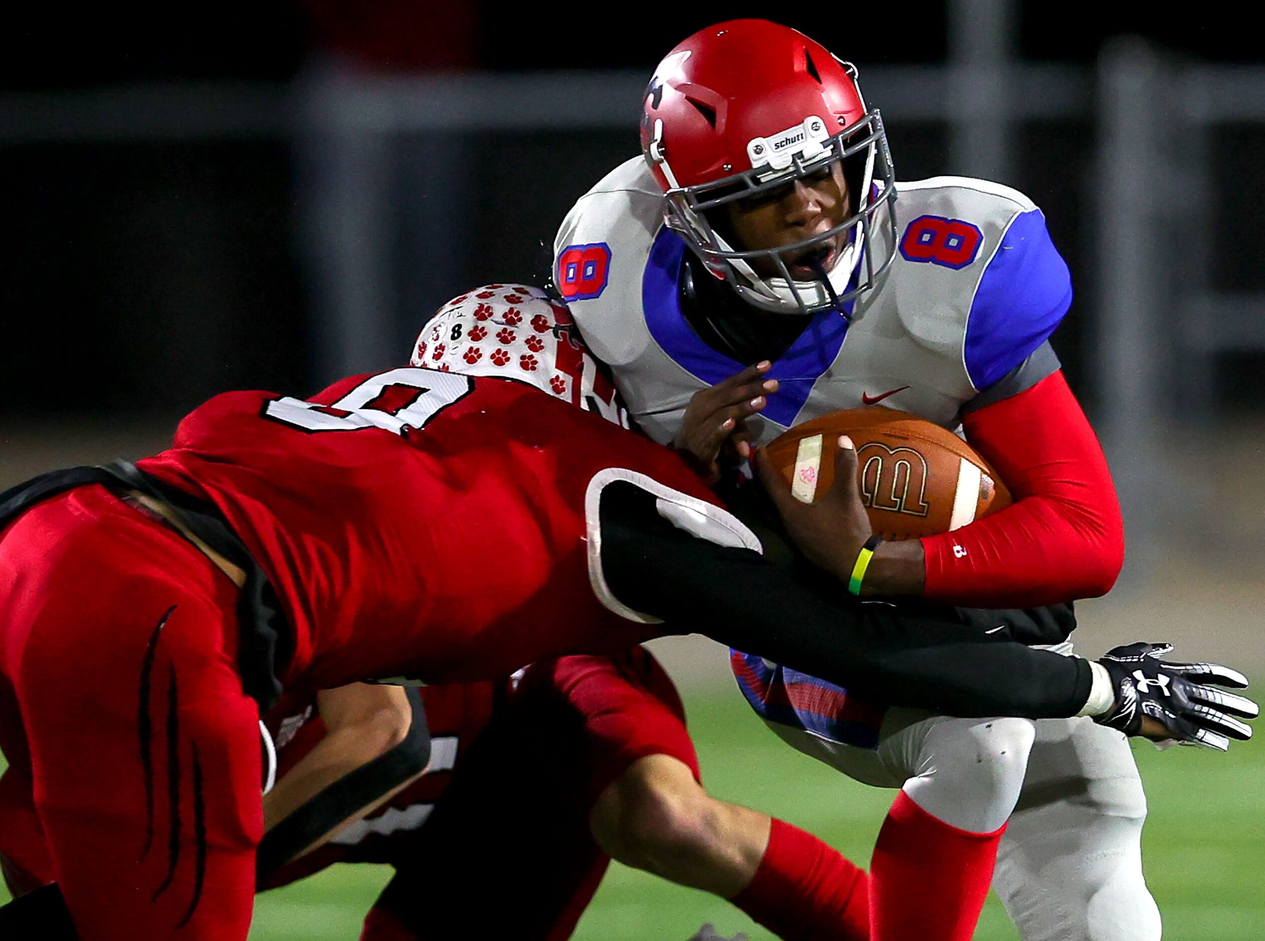 Spruce quarterback Kelvin Jones (8) is stopped for no gain by Hillcrest  linebacker Brady...