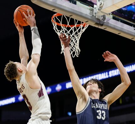 Mansfield Timberview guard Chendall Weaver (3) dunks the ball over Boerne Champion guard...