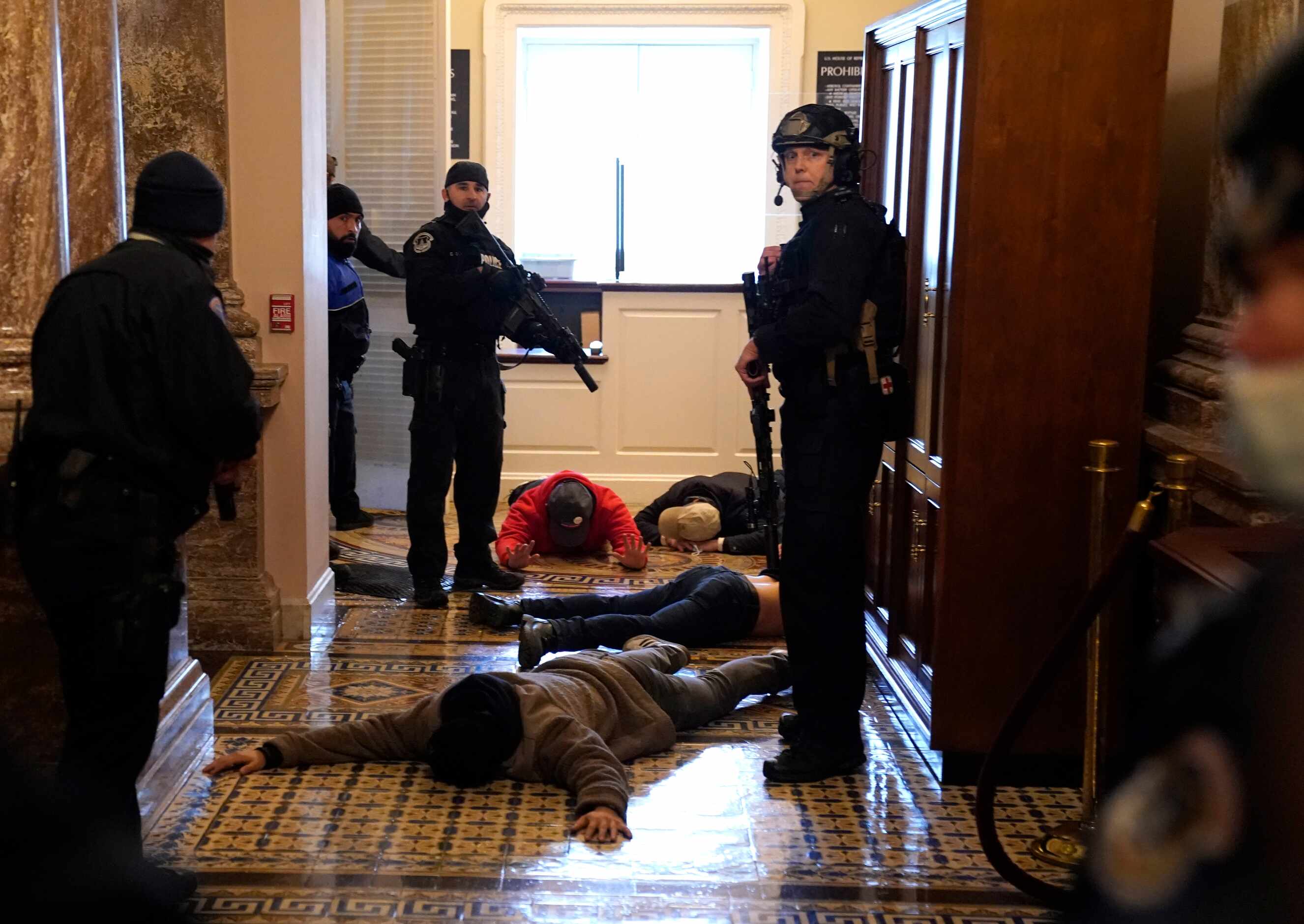 WASHINGTON, DC - JANUARY 06: U.S. Capitol Police stand detain protesters outside of the...