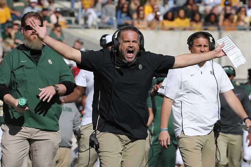 Baylor head coach Matt Rhule lets out a yell in the first half of an NCAA college football...