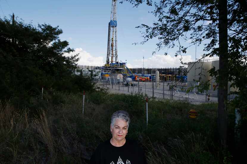 Rhonda Love of the Denton Drilling Awareness Group stands in front of a  hydraulic...