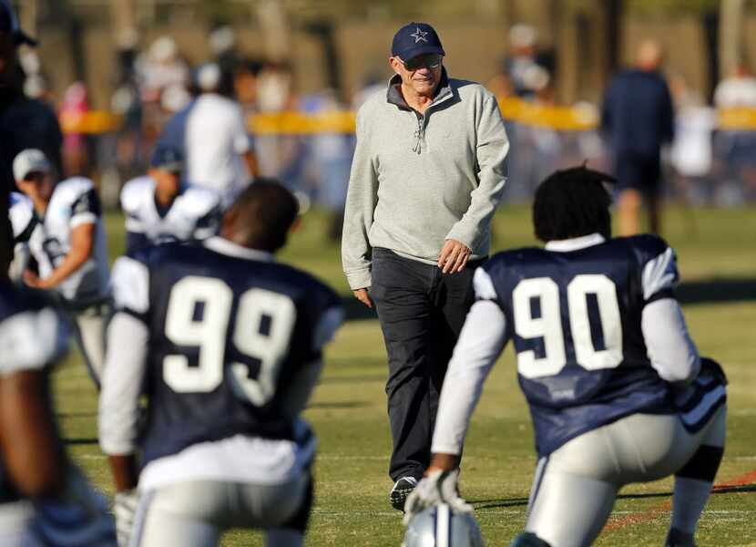 Dallas Cowboys owner Jerry Jones walks the football field following afternoon practice at...