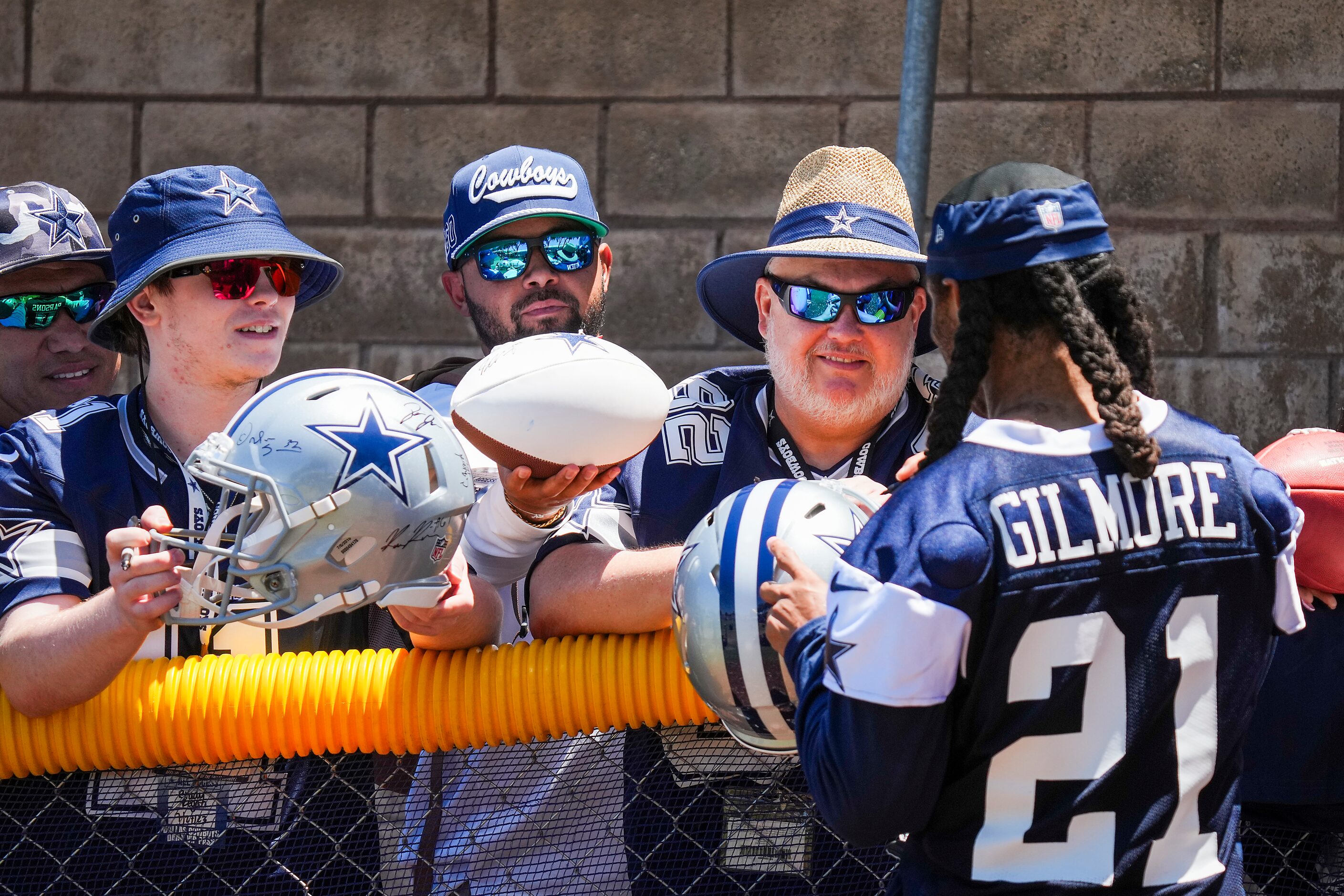 Dallas Cowboys cornerback Stephon Gilmore (21) signs autographs after a training camp...