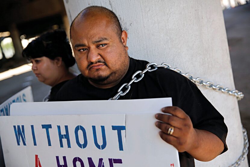 Lee Cadena (clockwise from bottom left) and his wife, Diane, chained themselves to an...