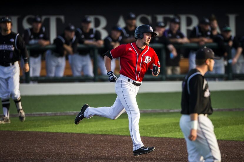 Dallas Baptist outfielder David Martinelli rounds the bases after hitting a two-run home run...