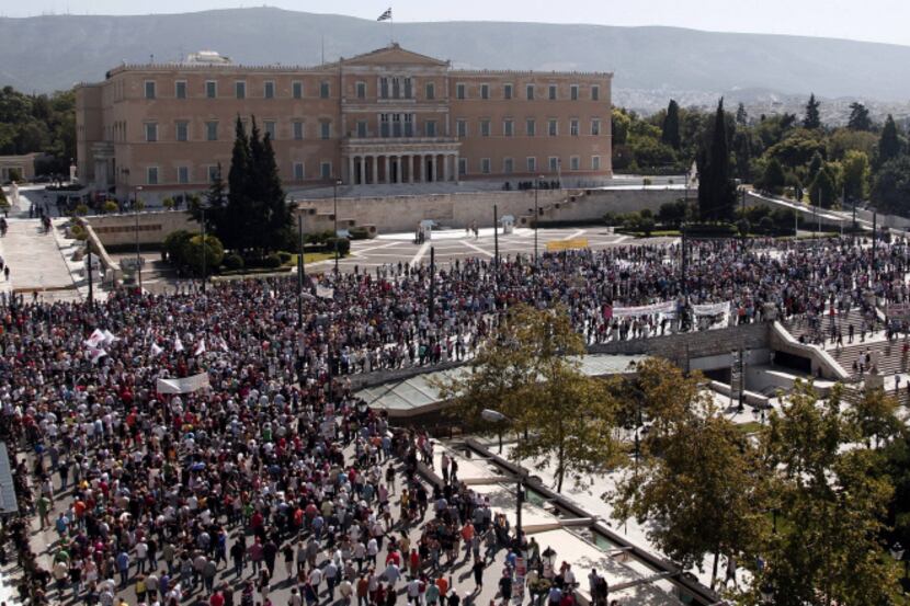 Demonstrators gathered on September 26 outside the parliament in Athens during a one day ...