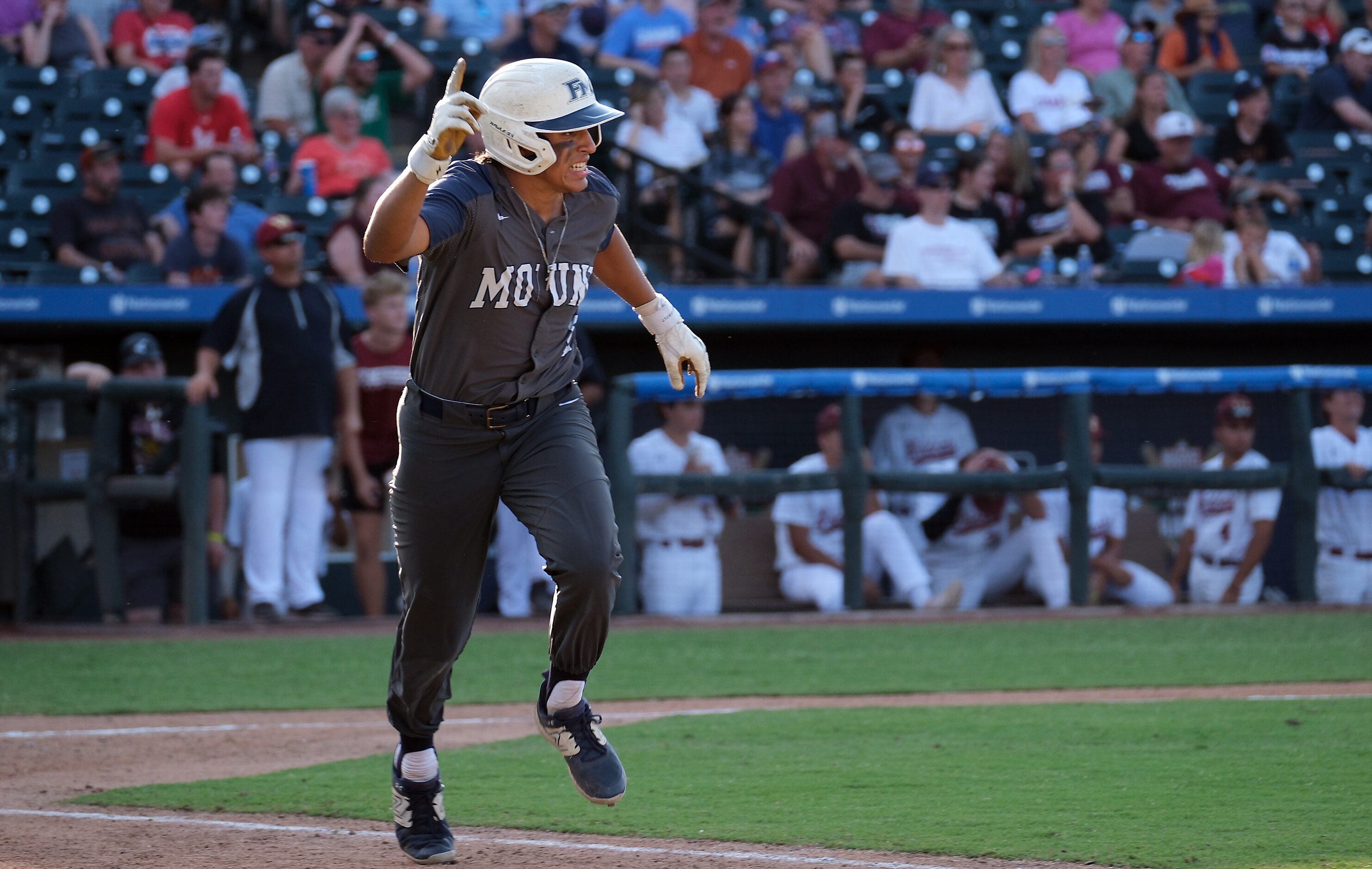 Flower Mound Adrian Rodriguez, (2), celebrates his RBI single against Cypress Woods during...