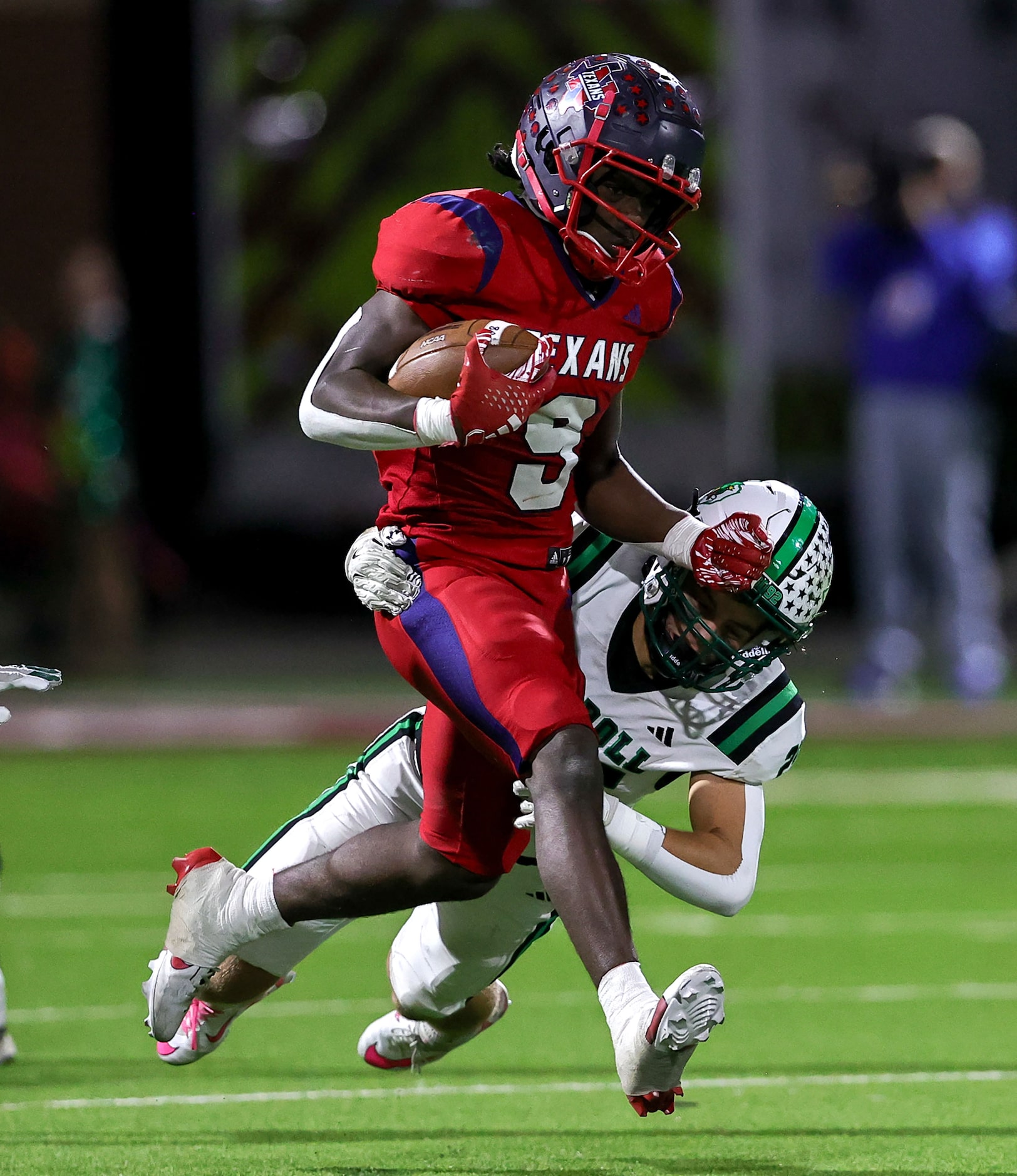 Justin Northwest running back Nate Jean (9) finds a hole to run, as he is finally stopped by...