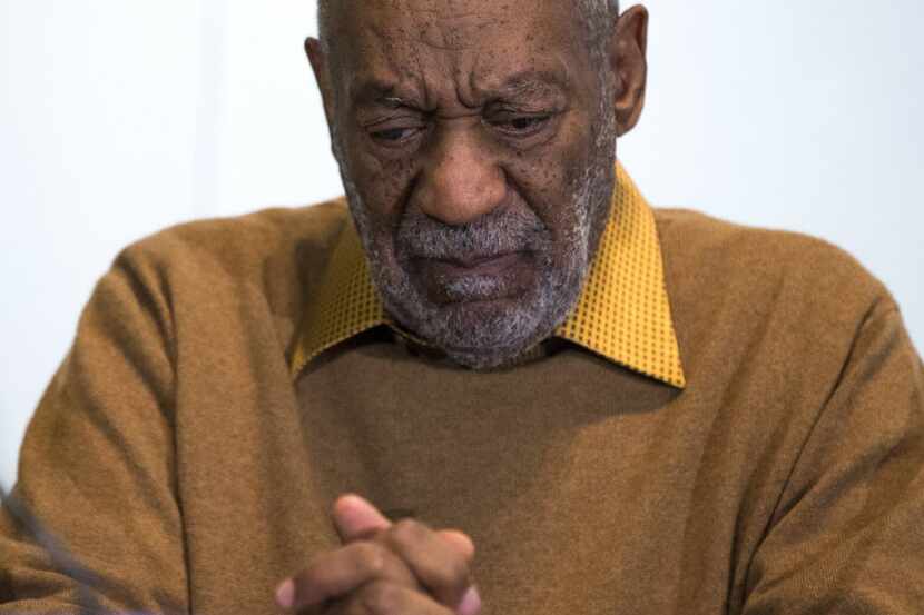 
Bill Cosby pauses during a news conference last year. 
