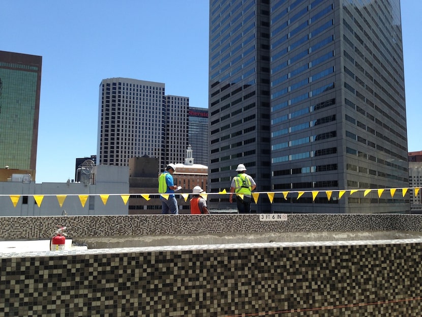  A rooftop pool under construction at the Mayflower Building will serve the 215 apartments....