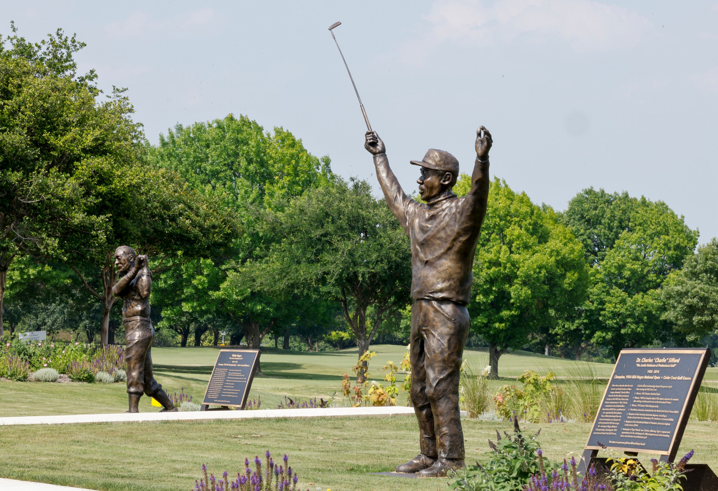 Statues of Walter Hagen (left) and Charlie Sifford pictured at Cedar Crest Golf Course on...