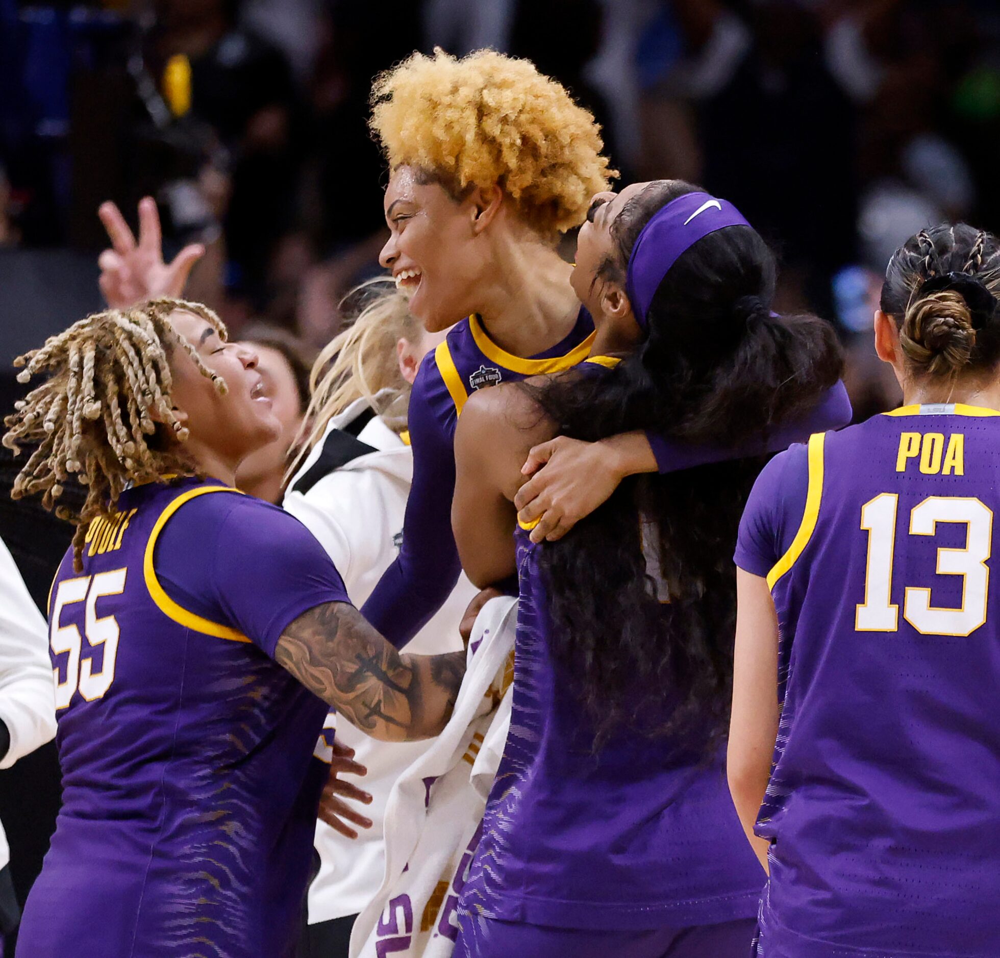 LSU Lady Tigers guard Jasmine Carson (center) is congratulated by her teammates after...