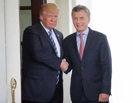 President Donald Trump shakes hands with Argentine President Mauricio Macri outside the West...