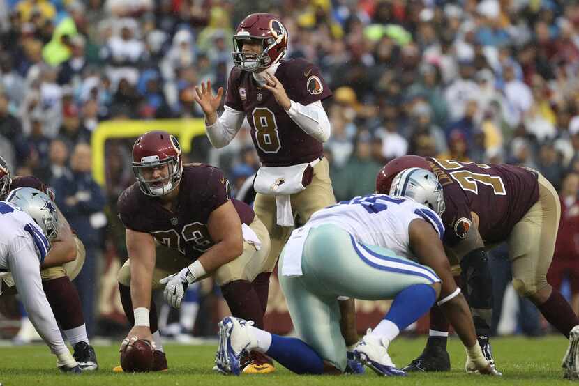 LANDOVER, MD - OCTOBER 29: Quarterback Kirk Cousins #8 of the Washington Redskins readies...