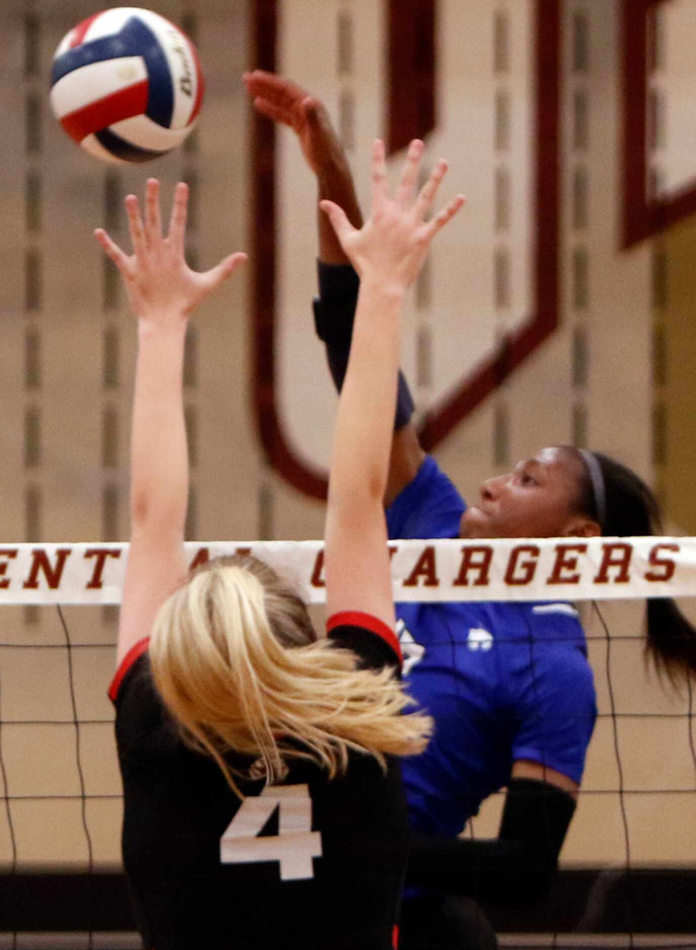 Trophy Club Byron Nelson Charitie Luper (10) drops a shot over the defense of Coppell...