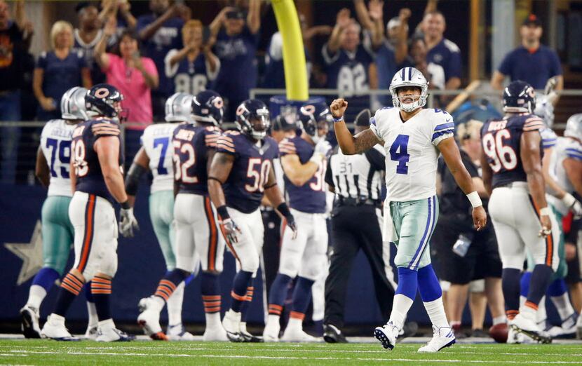 Dallas Cowboys quarterback Dak Prescott (4) pumps his fist after Dallas Cowboys running back...