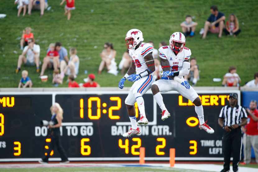 Southern Methodist Mustangs defensive back Darrion Millines and defensive back Horace...