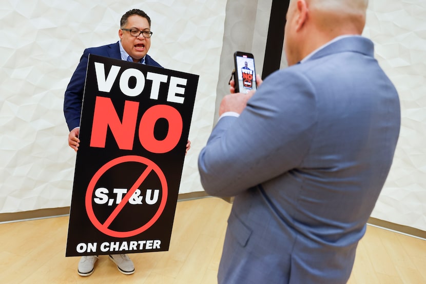 City Council District 6 council member Omar Narvaez records a video holding a sign following...