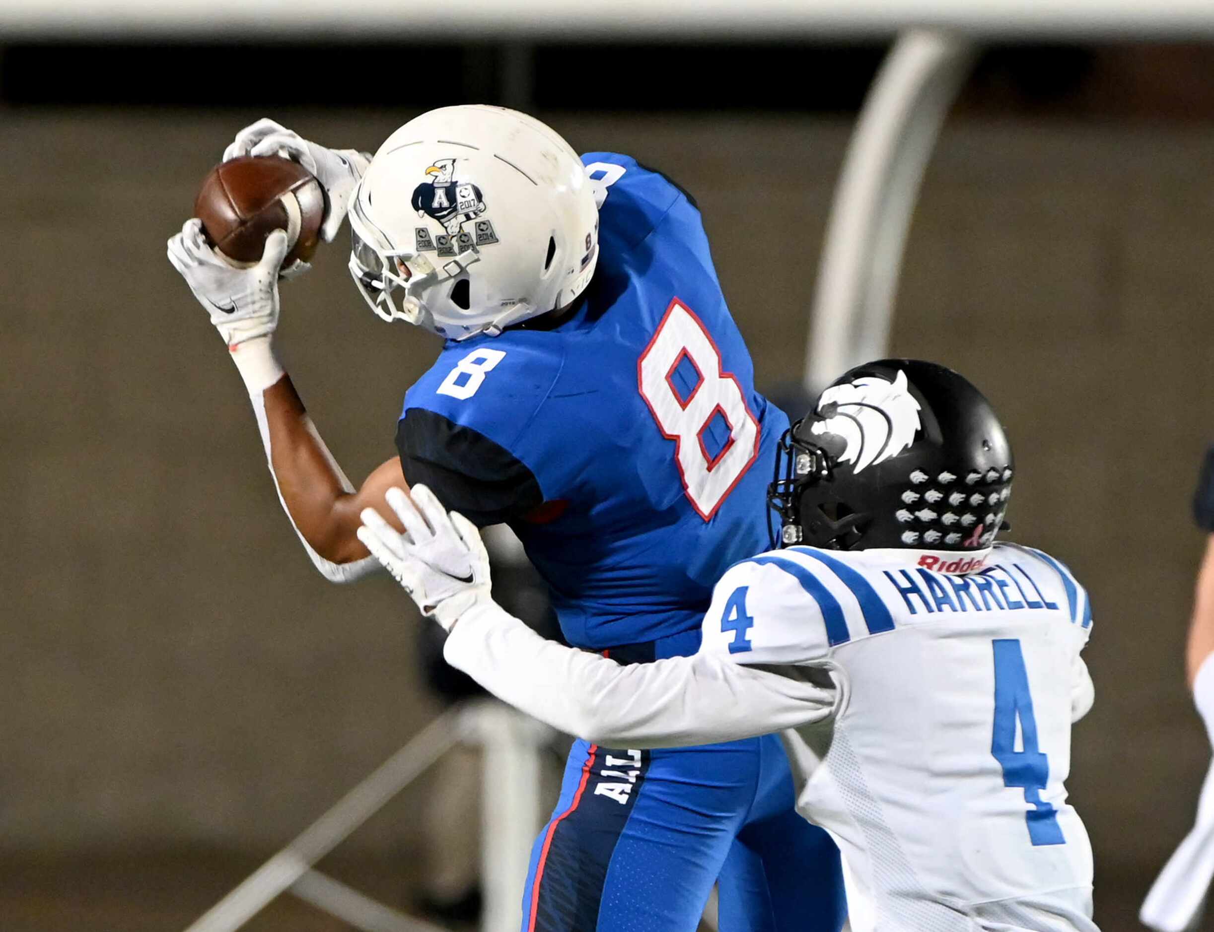 Allen’s Blaine Green (8) catches a pass in front of Plano West’s Tyler Harrell (4) in the...