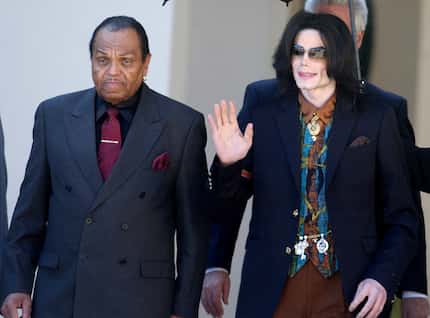 In this 2005 file photo, Joe Jackson walks with son and pop star Michael Jackson.