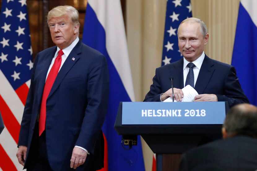 President Donald Trump and Russian President Vladimir Putin arrive for a press conference...