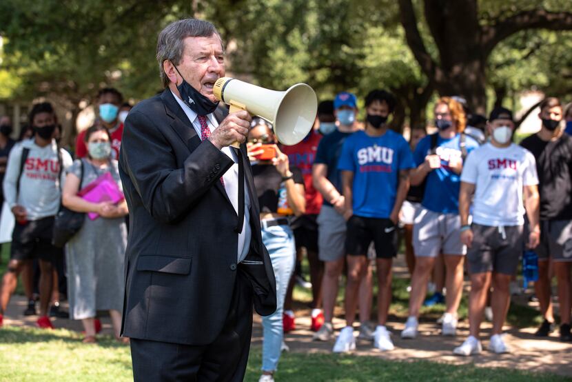 SMU president R. Gerald Turner speaks to student athletes before the start of a march for...
