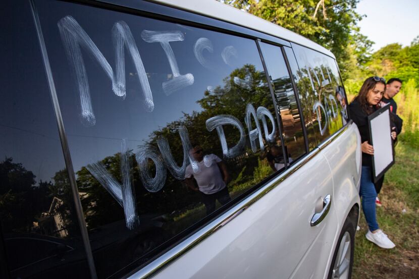 A month after Lazarus De La Torre's death, one of the family cars still carries the message...