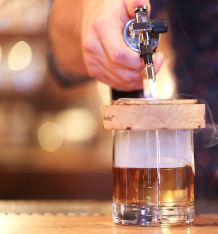 Tanner Agar prepares a Jamón Rye Old-Fashioned, a cocktail that may make Flamant's menu in...