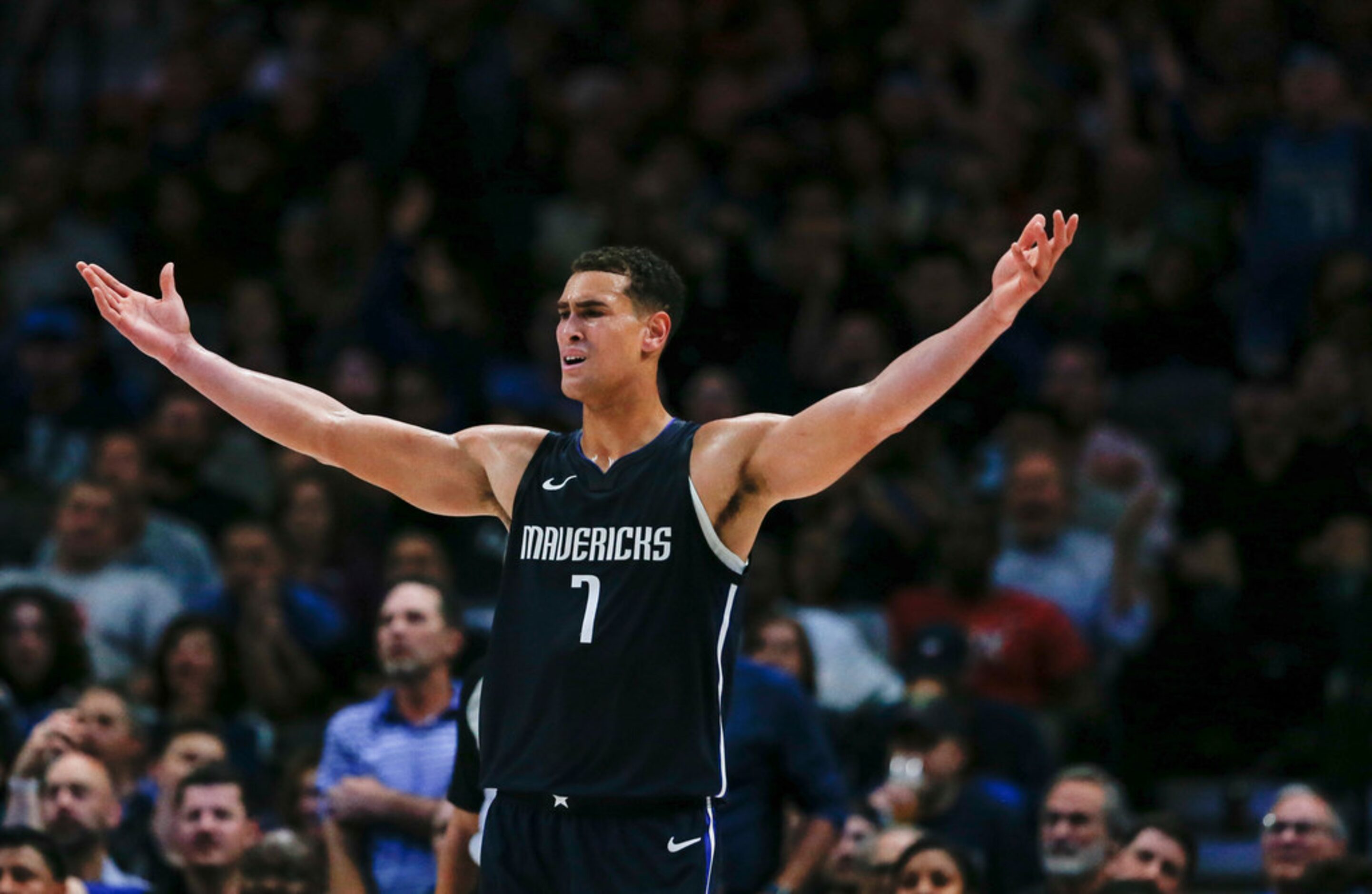 Dallas Mavericks forward Dwight Powell (7) reacts to an official's call during the third...