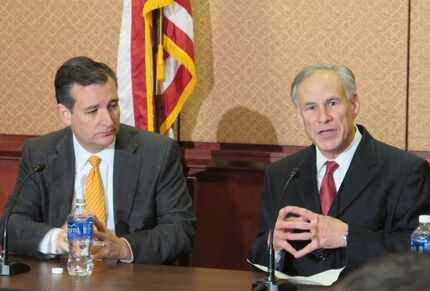  Sen. Ted Cruz and Gov. Greg Abbott (right) denounced the Obama administration's policy on...