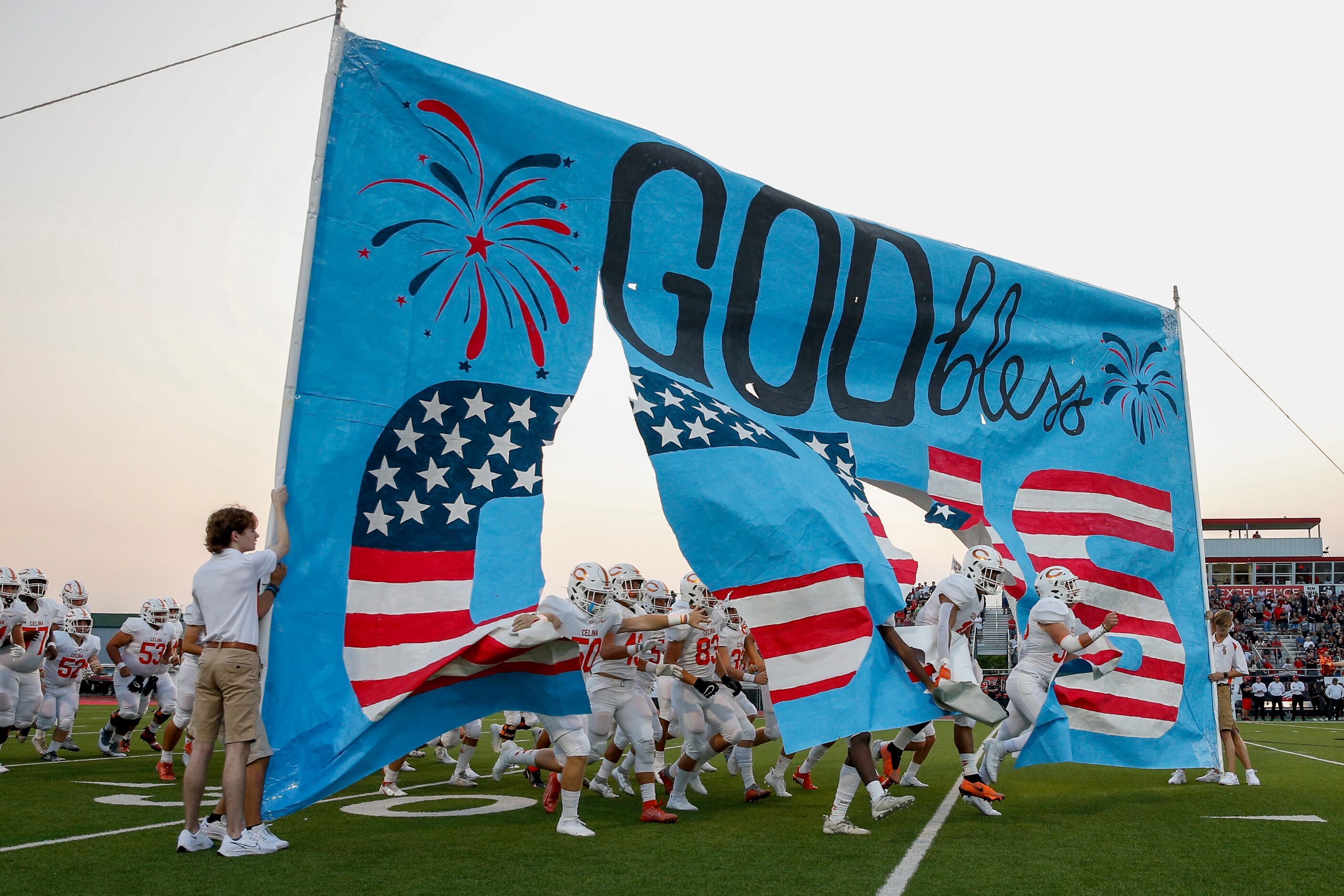 The Celina football team takes the field before the first half of a high school football...