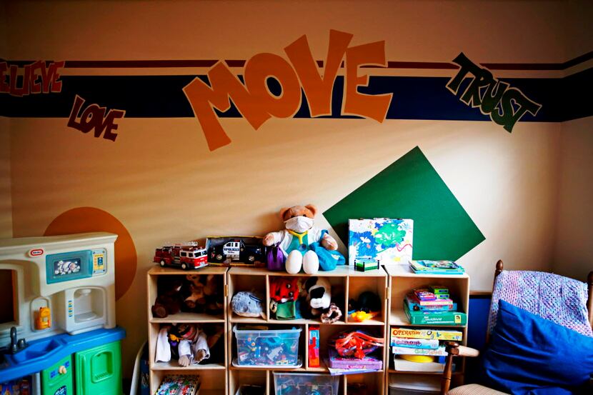 Stuffed animals, toys and board games are found in a room used for treatment and therapy at...