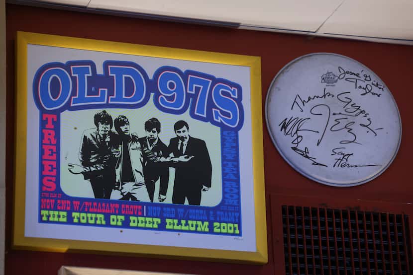 The poster for the of the Old 97′s Tour of Deep Ellum in 2001 hangs on the wall of AllGood...
