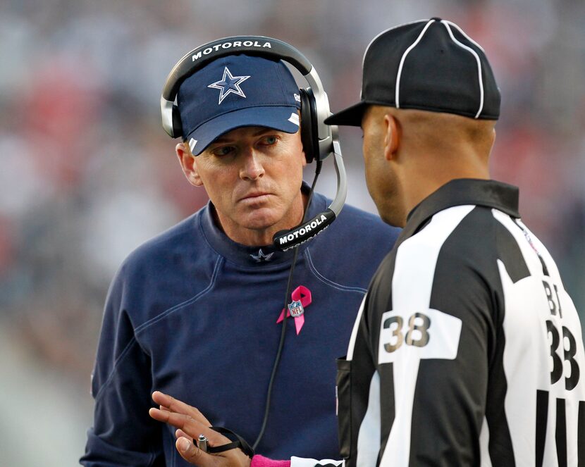 Head coach Jason Garrett listens to back judge Greg Yette (38) in the first half of the...