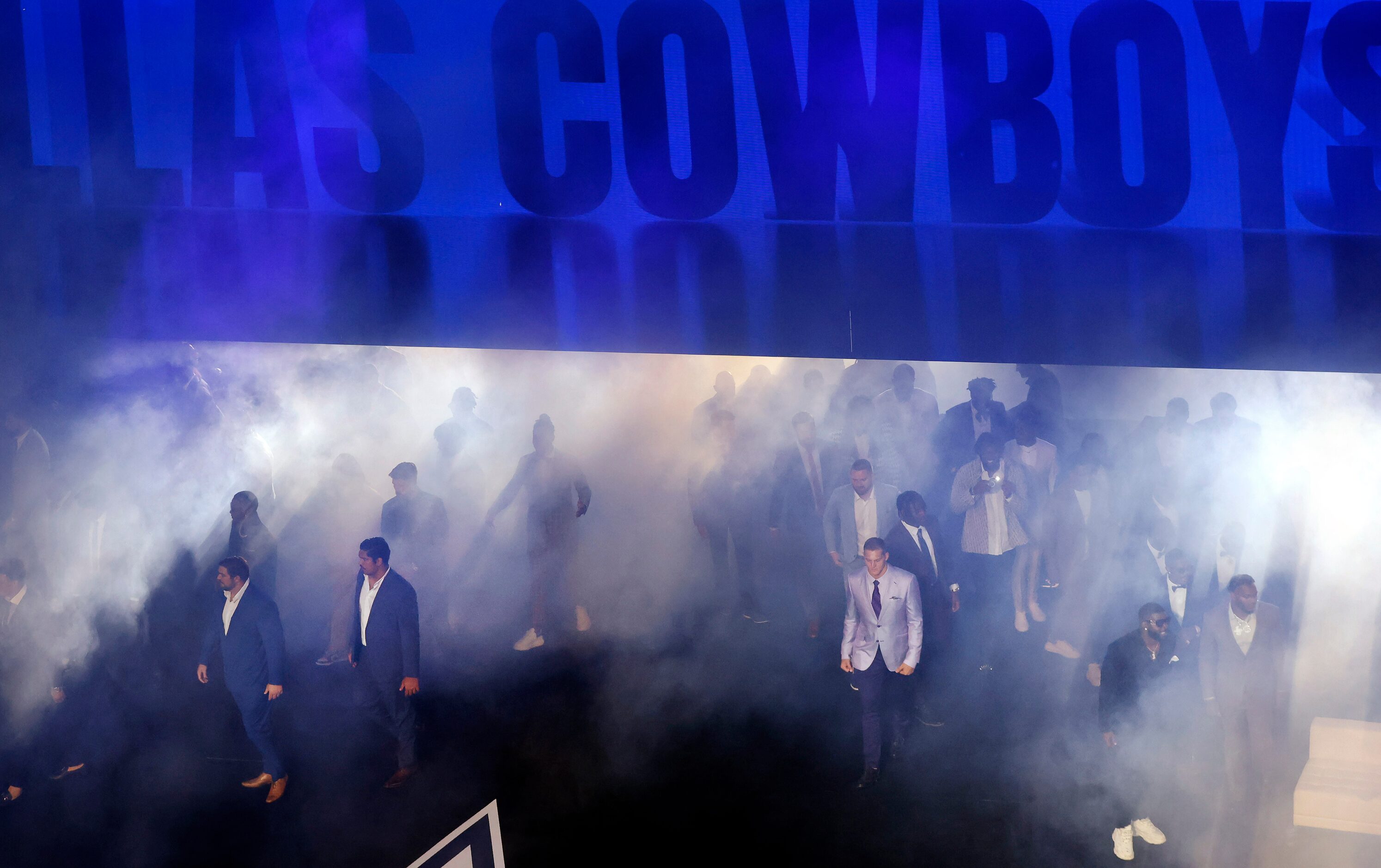 The Dallas Cowboys football players are introduced in a sea of fog at the Dallas Cowboys...