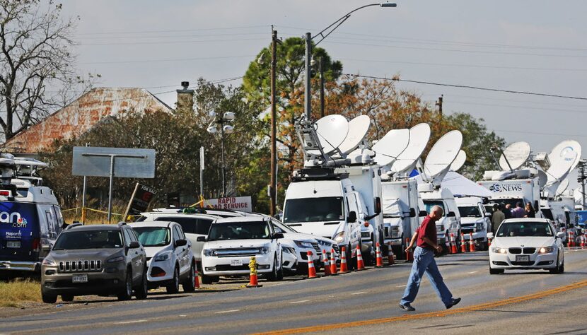 Satellite trucks line Highway 87 in Sutherland Springs on Nov. 7.