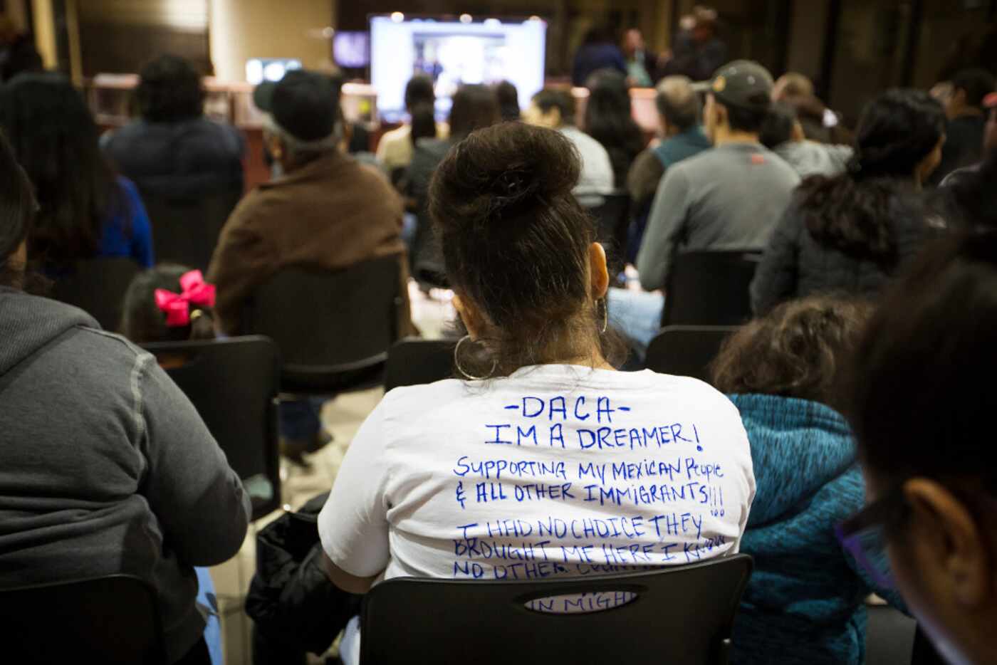 A woman wears a shirt identifying herself as a "Dreamer" - people effected by the Deferred...