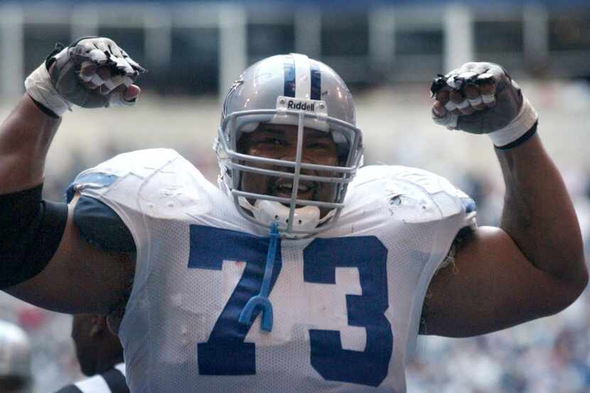 Dallas Cowboys offensive lineman flexes after a Marion Barber touchdown run in 2005. Allen,...