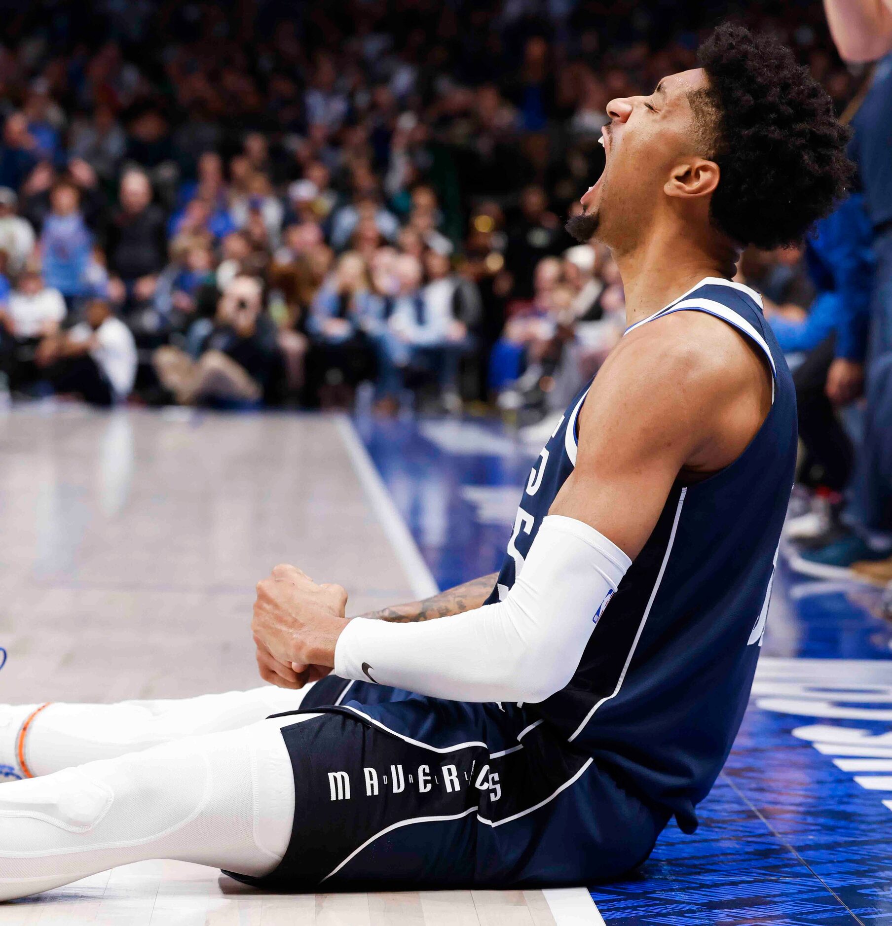 Dallas Mavericks forward Christian Wood (35) reacts after scoring a three-pointer during the...