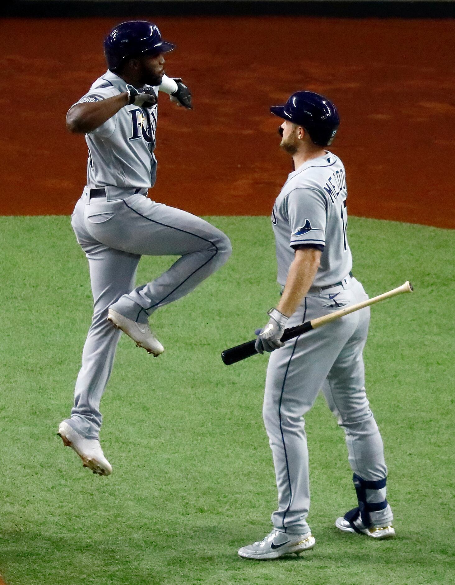 Tampa Bay Rays left fielder Randy Arozarena (56) is congratulated on his first inning solo...