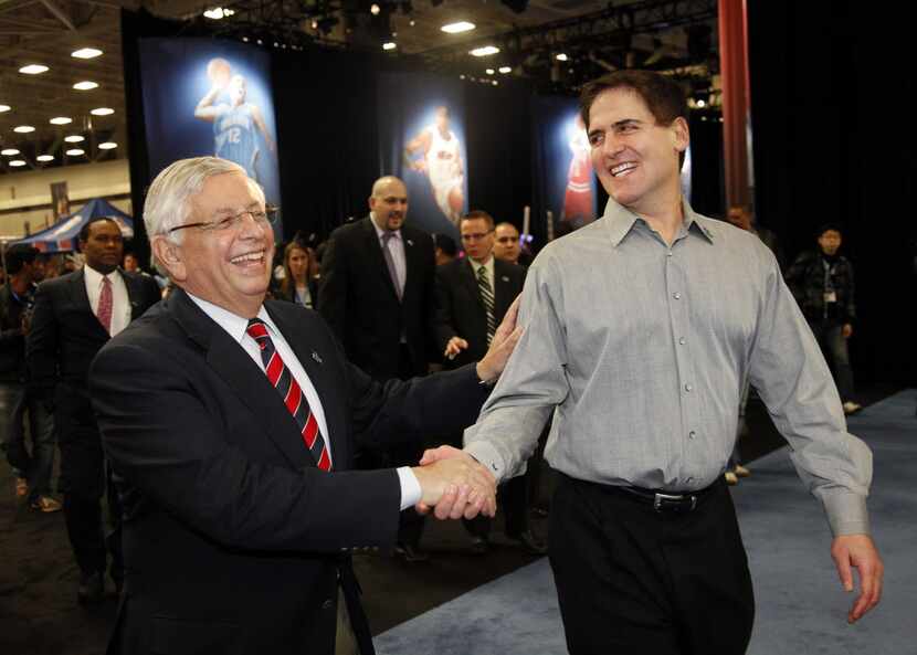 NBA Commissoner David Stern (left) and Dallas Mavericks owner Mark Cuban shake hands...