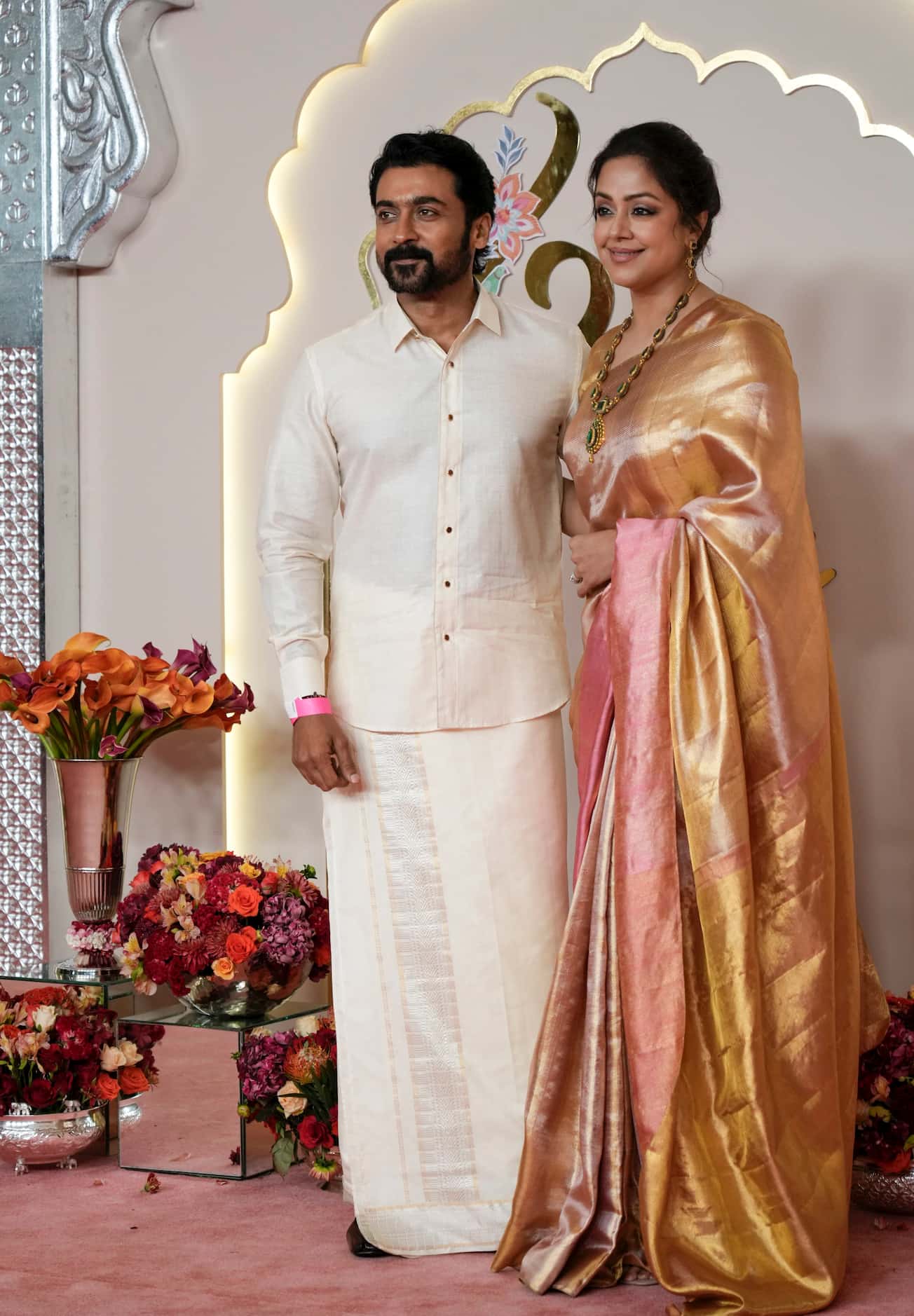 Indian actor Suriya poses with wife Jyothika 