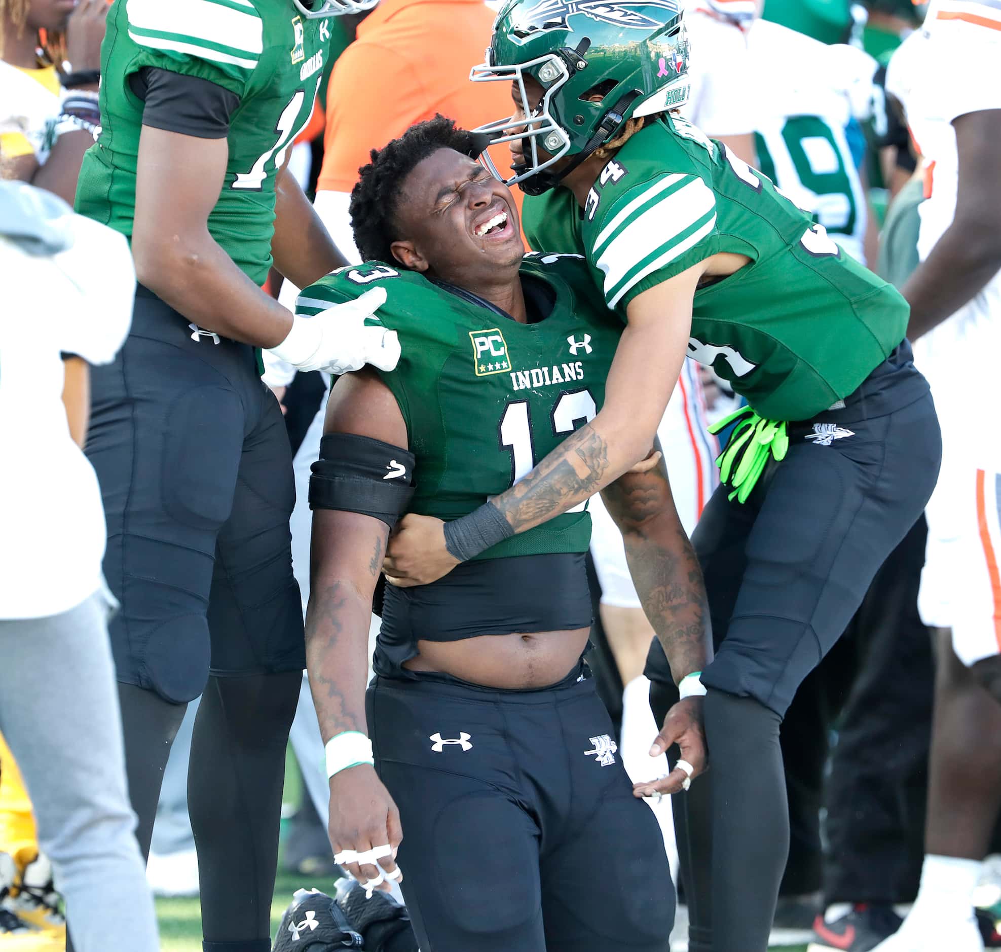 Waxahachie High School defensive end Jermy Jackson Jr. (13) is helped to his feet after...
