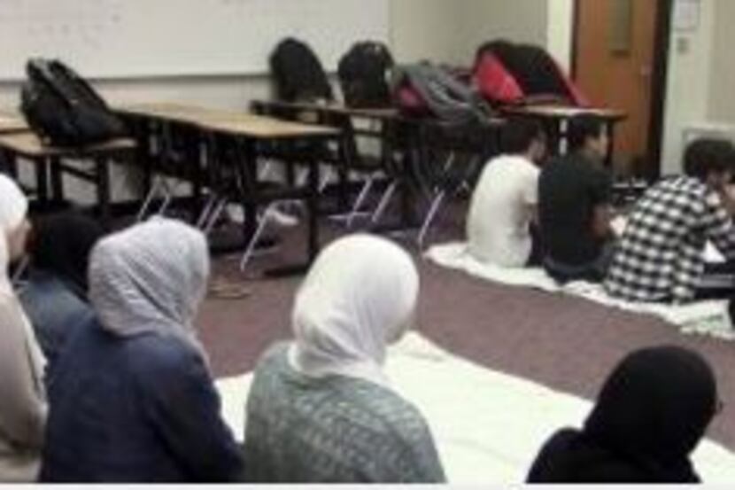 Liberty High School students use an empty classroom to pray. The school has been offering...